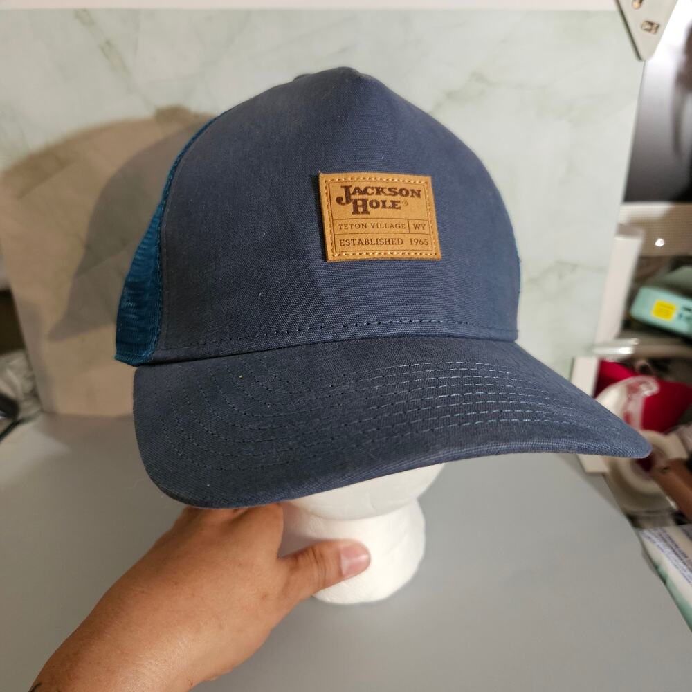 This Jackson Hole Hat from Fisher Gear is a snapback trucker style baseball cap